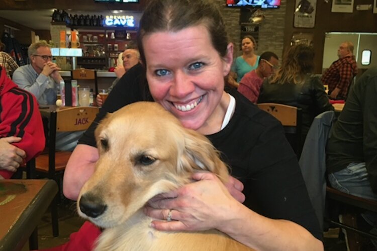 Candace Carlisle with her Paws With A Cause dog, Denali. (Courtesy)