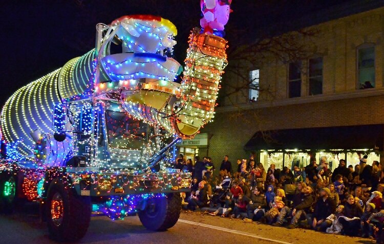 A cement truck wrapped in lights takes part in Holland's Parade of Lights.