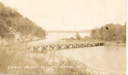 Port Sheldon's Pigeon Lake Bridge is shown in a historical photograph.