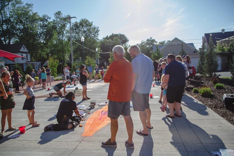 Passersby admire a chalk creation during Zeeland's Chalk Festival in this file photo.