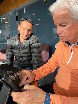 Charles “Charlie” Elwood and Chris Martin using version 2.0 of Martin’s voice for the first time at Carpe Latte Coffee Shop.