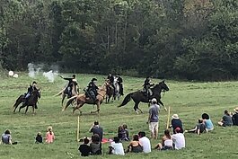 Spectators watch the 2019 Civil War Muster at Van Raalte Farm. (Mary Bale) 