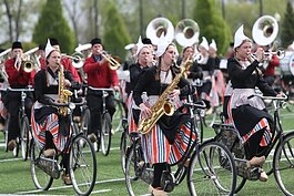 Bicycle Showband Crescendo performs at Hope College’s Ray and Sue Smith Stadium during the debut performance at the Tulip Time Festival, May 12.