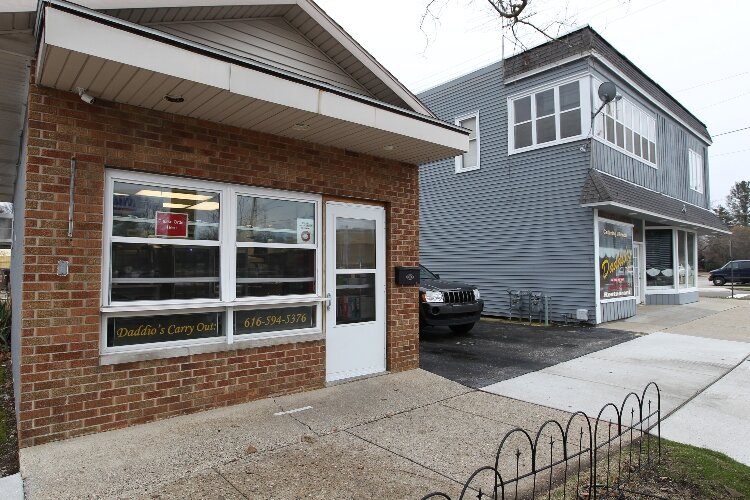 Daddio's carry-out restaurant at 567 College Avenue in Holland, Michigan. The tiny kitchen restaurant with outdoor seating opened on May 23, 2008. (J.R. Valderas)