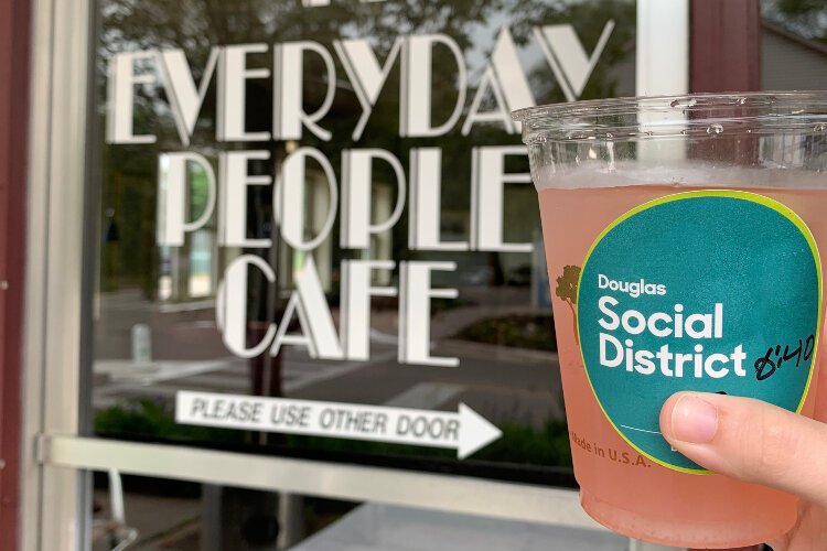 Proponants for social districts say a drink in hand makes the wait more bearable for restaurant patrons who are up to an hour away from being seated, and it benefits nearby shops.