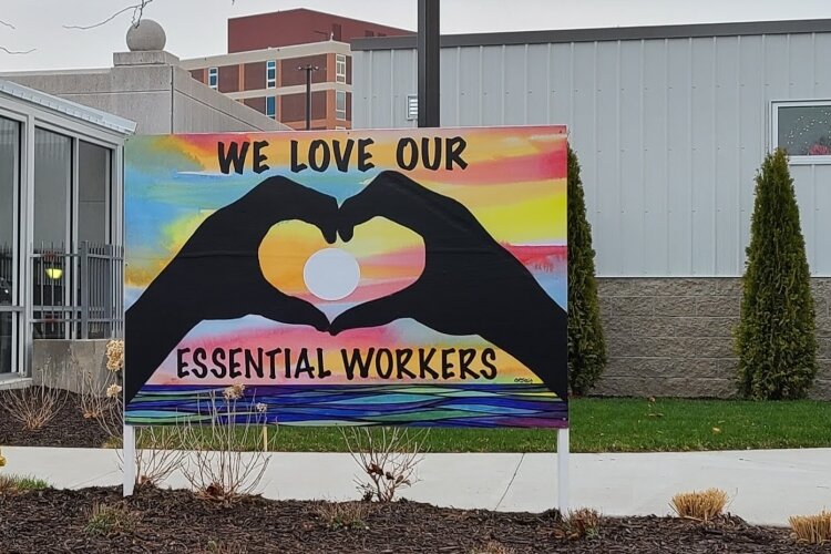 Carolyn Stich is honoring essential workers with this sign and five others. 