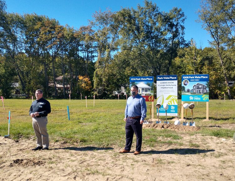 Jubilee Ministries Executive Director Steve Grose and Lakeshore Habitat for Humanity Executive Director Don Wilkinson speak to a crowd before a ceremonial groundbreaking at Park Vista Place, a joint project of the two, on East 40th Street in Holland.
