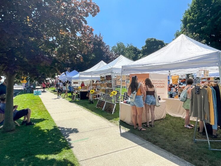 Festival goers browse through the craft show.