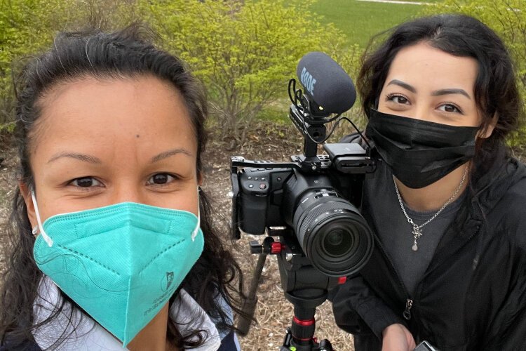 Crew members pose during the filming of "First Voice Generation."