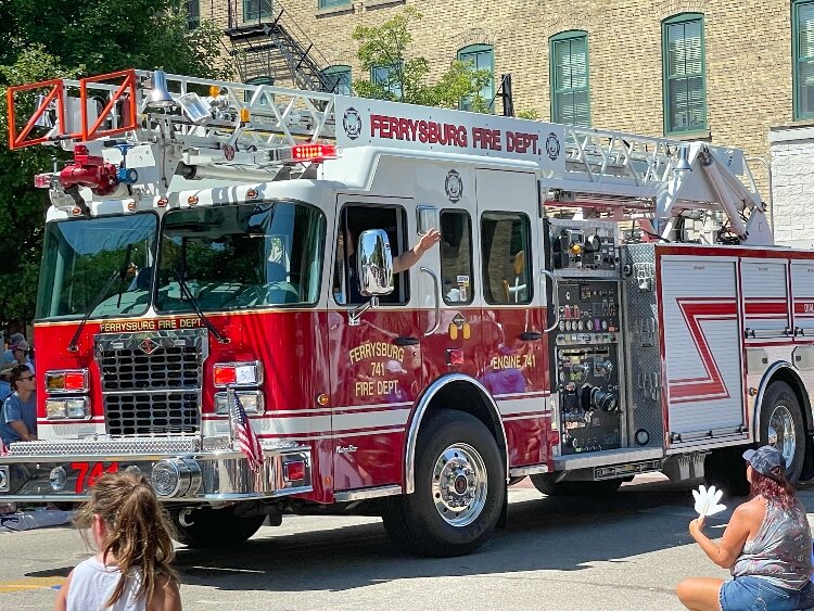 The Ferrysburg Fire Department truck drives in the Grand Parade.