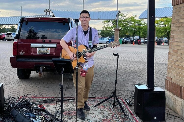 Rich Burkholer, a singer and guitarist from Avalon the Band, performed at the Block Party. (Downtown Holland)