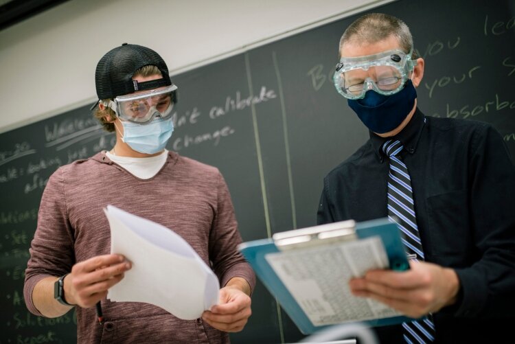 A GRCC student talks to his physical science professor. 