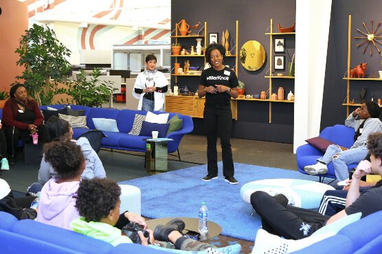 Tara Weymon Leonard, MillerKnoll’s vice president of global contract and field marketing, talks to I Am Academy students at the company's Design Yard.