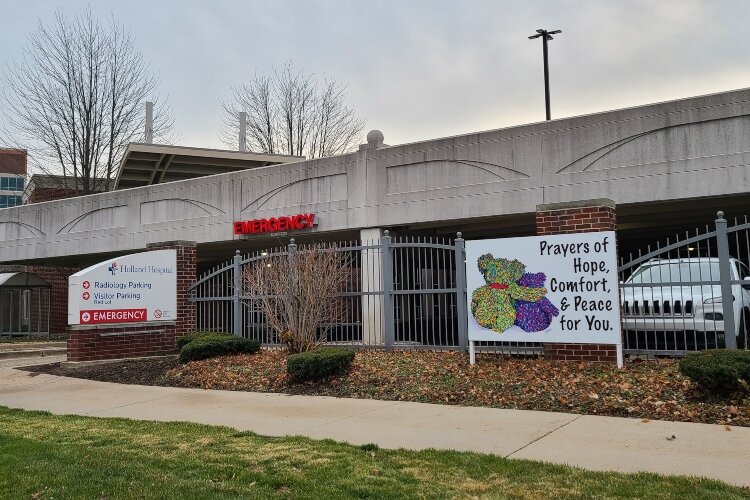 This sign is one of six Holland artist Carolyn Stich created to raise the spirits of health care workers and the community.