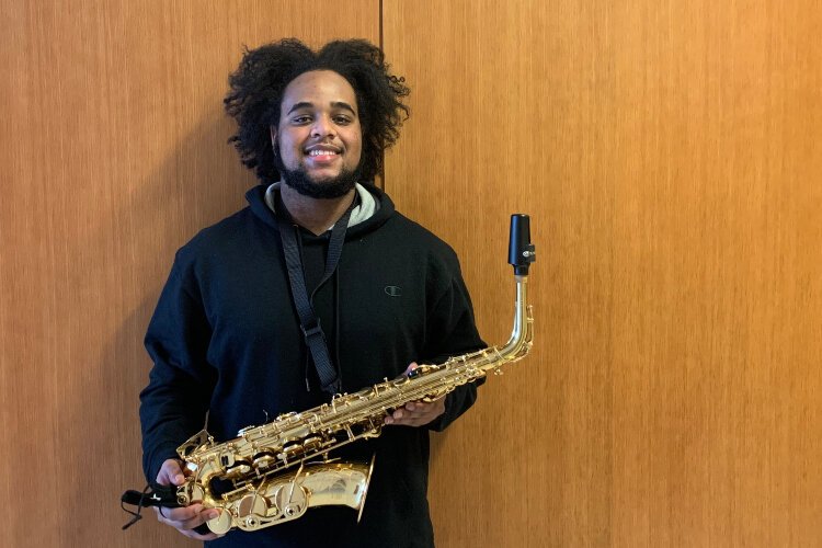 Hope College sophomore Houston Patton received the gift of a new saxaphone.