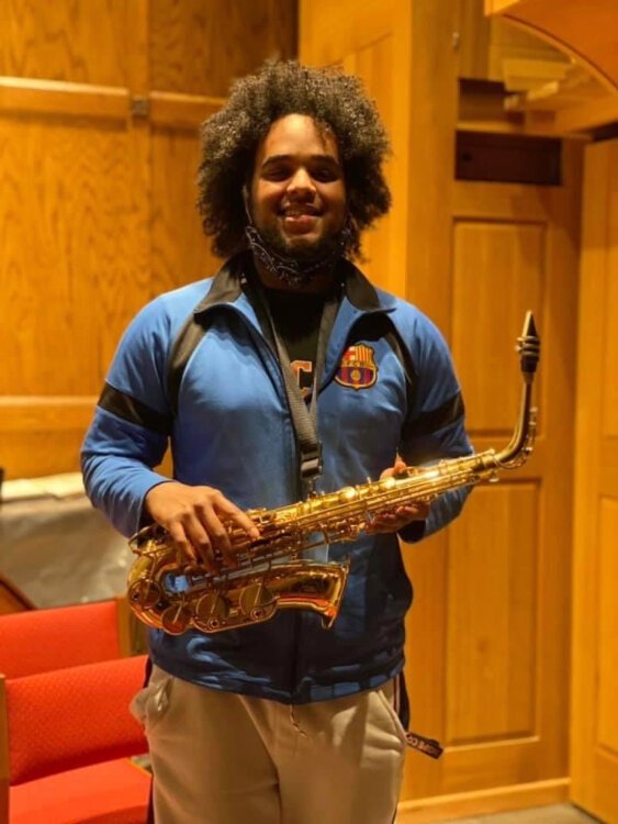 Hope College sophomore Houston Patton received the gift of a new saxaphone.