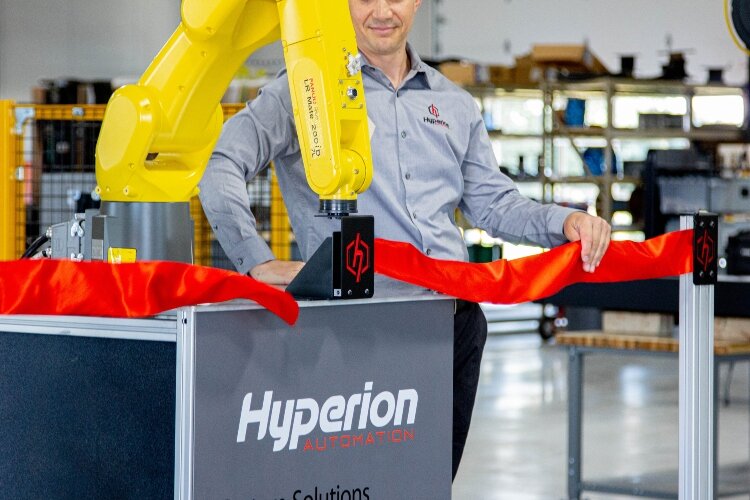 Hyperion Automation used its robot to cut the ribbon on its new facility.