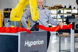 Hyperion Automation used its robot to cut the ribbon on its new facility.