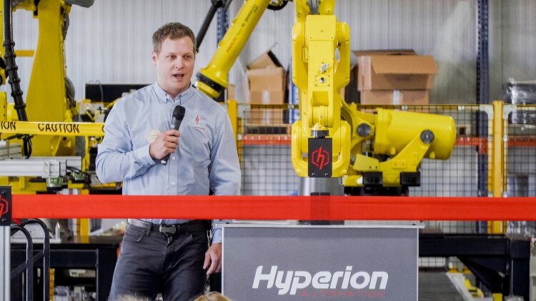 Hyperion President Jeremy Wright speaks at the company's ribbon-cutting. 