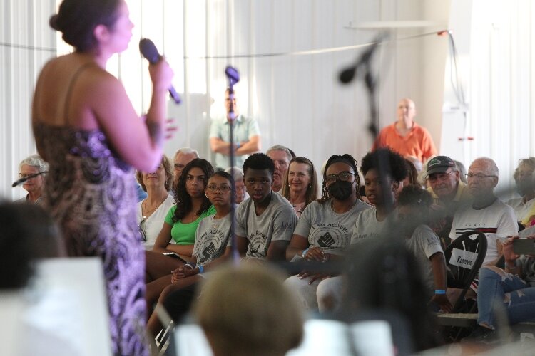 Members of the I AM Academy organization observe Sydney McSweeney's performance with the Holland Symphony Orchestra while attending the "Pops at the Pier" concert at Eldean Shipyard in Macatawa, Michigan, June 16, 2022.
