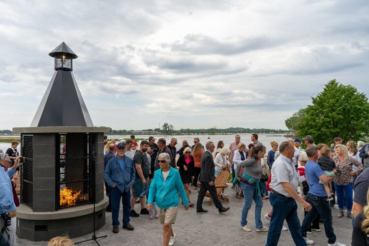 Residents exploring Tanglefoot Park’s new patio and fireplace. (Brittany Meyers)