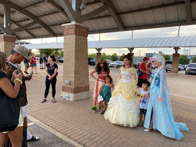 Children had their photos taken with Disney characters Moana, Ariel, and Belle. (Shandra Martinez)