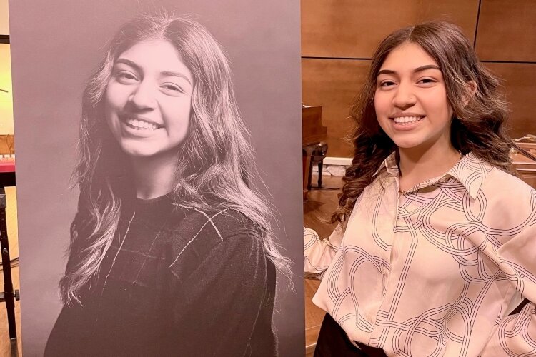 Jaquelin Romero poses with her portrait before the Boys and Girls Club of Greater Holland's Youth of the Year ceremony.