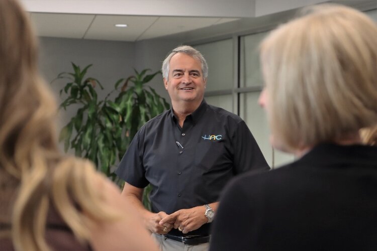 Jack Huisingh talks with visitors at a HAC event.