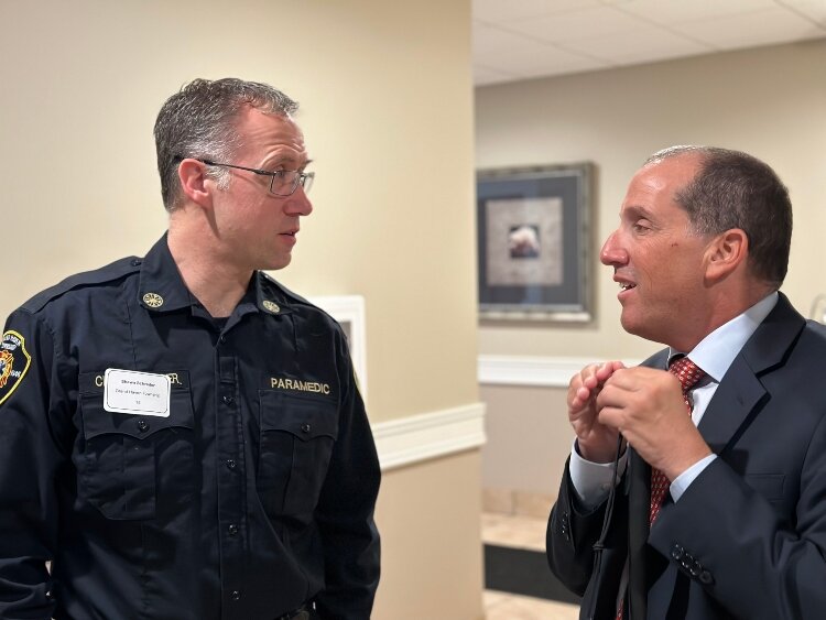 Grand Haven Township Fire/Rescue Chief Shawn Schrader speaks to Michigan Justice Richard Bernstein. (Shandra Martinez)