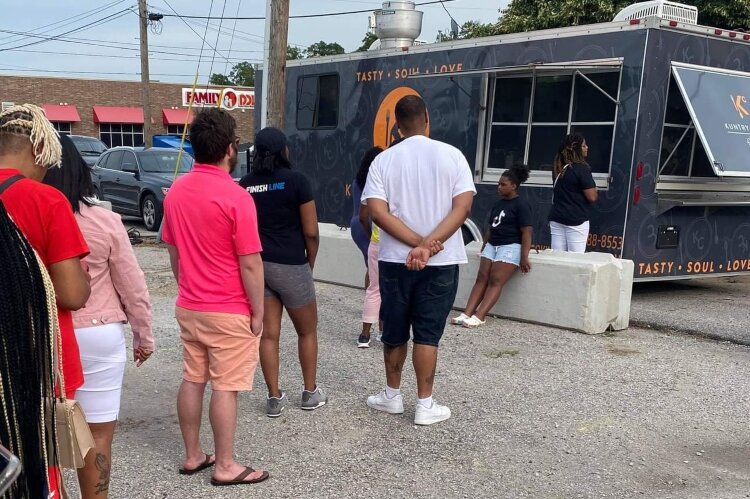 Customers line up at the Kuntry Cookin' food truck in Muskegon.
