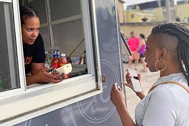 A customer orders at the Kuntry Cookin' food truck in Muskegon.