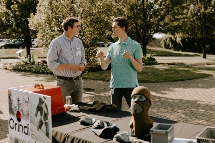 Jordan Vanderham, on the right, at his Orindi Gear booth at the SURGE Celebration on June 17, 2021. (JaymiJoy Photography)