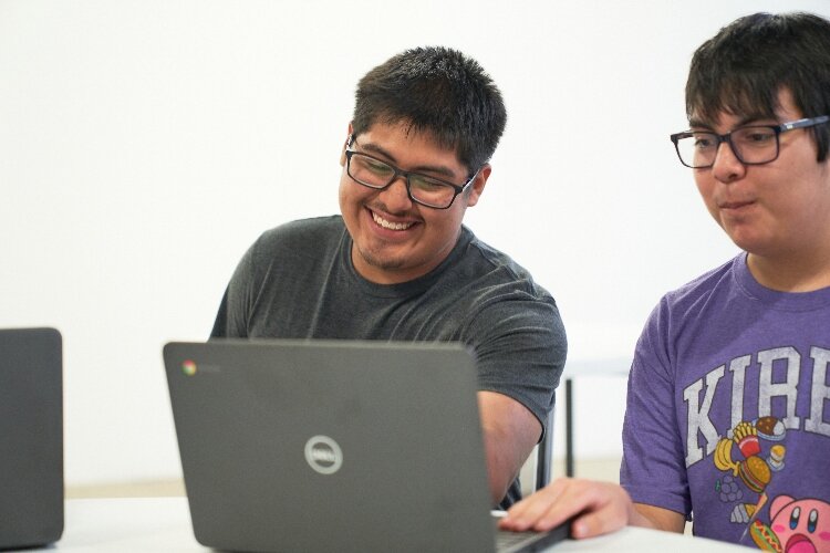 The laptop donation was announced when students gathered at the LAUP on Sept. 5 to celebrate the start of its ¡Adelante! youth program. (Comcast)