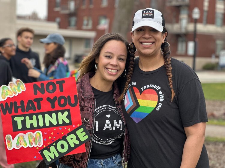 Co-founder of I AM Academy Lindsay Cherry, right, and her sister Lauren Beck helped to organize a unity march this week in Holland.