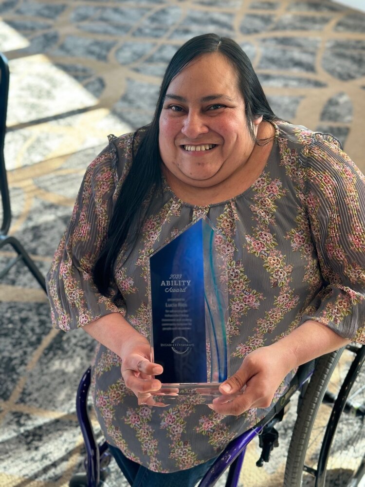 Disability Inclusion Series Editor Lucia Rios receives 2023 Ability Award from Disability Network Lakeshore. (Shandra Martinez)