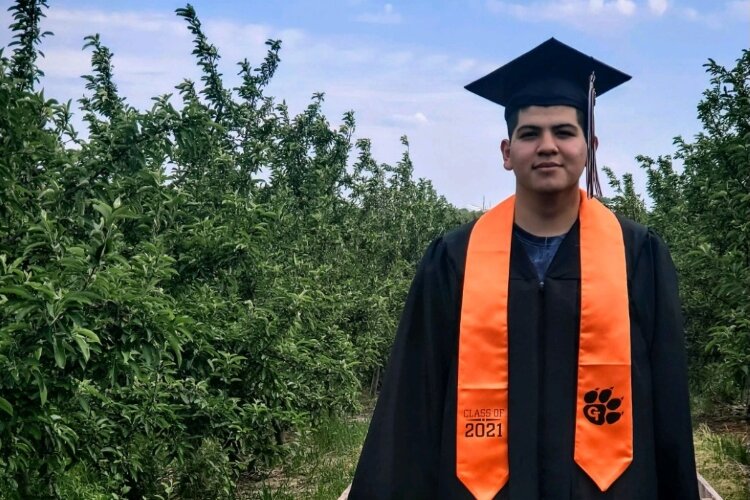 Luis Montes, 18, works for a produce-growing company in Newaygo along with his parents, who arrived here years ago from Mexico to pick apples. Montes was born in the U.S.