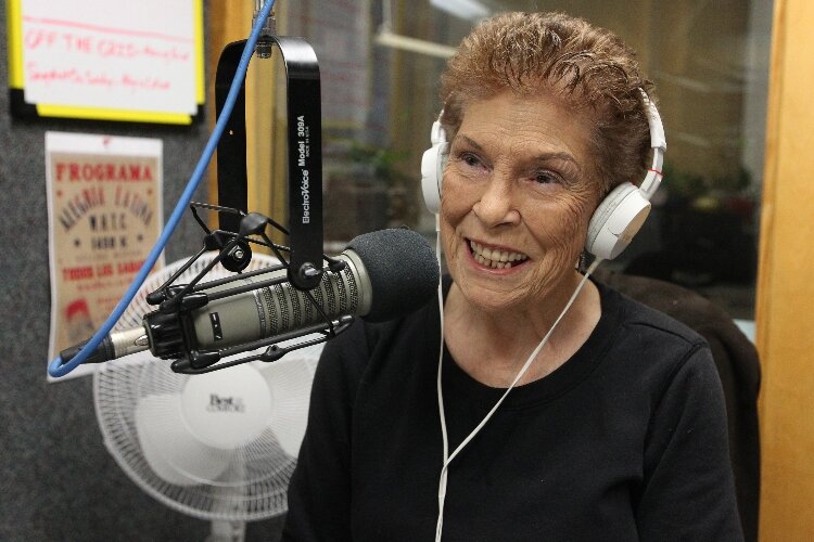 DJ "La Tejanita - Sweet Lu" Lupita Reyes speaks on the air during her radio program "Alegria Latina" at the 92.7 FM The Van/WHTC 1450 AM studio in Holland, Michigan, Nov. 28, 2021. (J.R. Valderas)