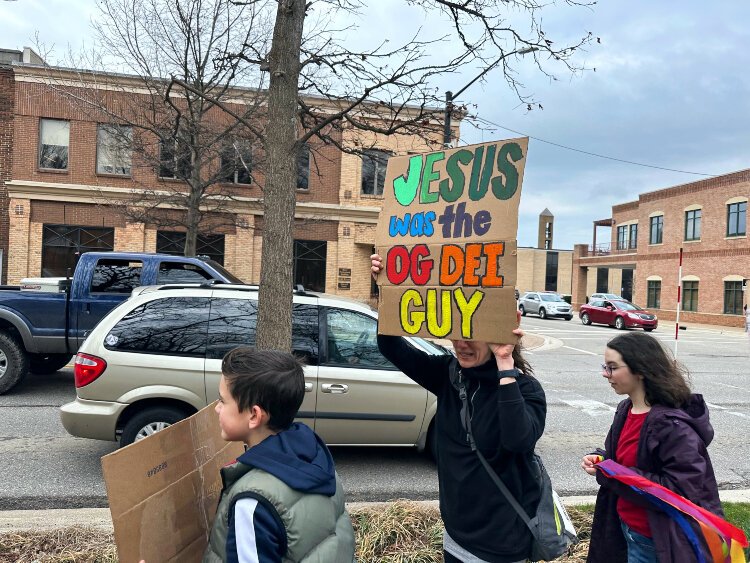 Hundreds of demonstrators marched across Holland's Unity Bridge Saturday in a show of support of diversity.