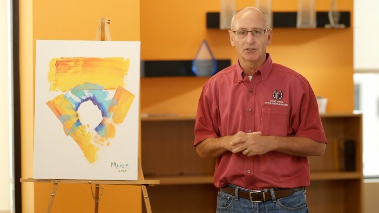 Mark Herman with his ArtPrize painting.