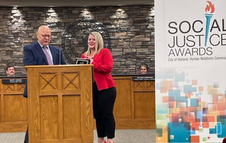 Ottawa County Public Defender Nichole Jongsma-Derks accepts the 2022 Holland Human Relations Commission's Government/Community Relations Social Justice Award.