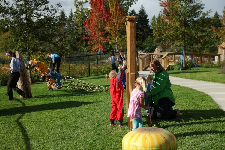 Children play at the existing natural playground of Little Hawks Preschool on the Outdoor Discovery Center campus.