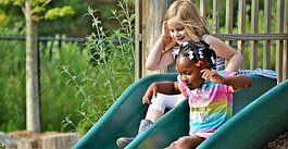 Children play at the existing natural playground of Little Hawks Preschool on the Outdoor Discovery Center campus.