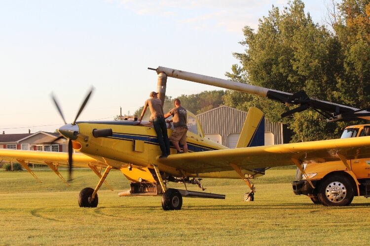 A crop duster plane is loaded is seed. (Photo by Bev Berens)