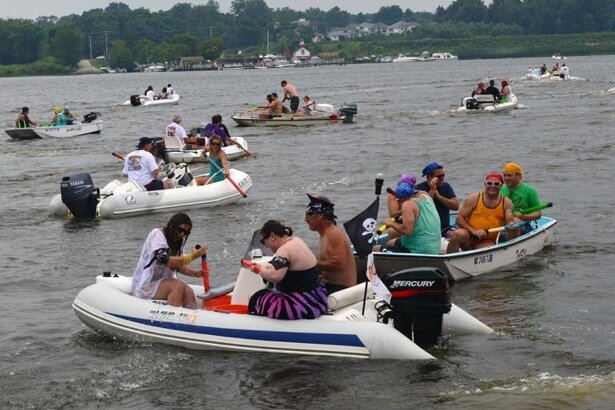 The Dinghy Poker Run is part of the Saugatuck Venetian Festival Lite.