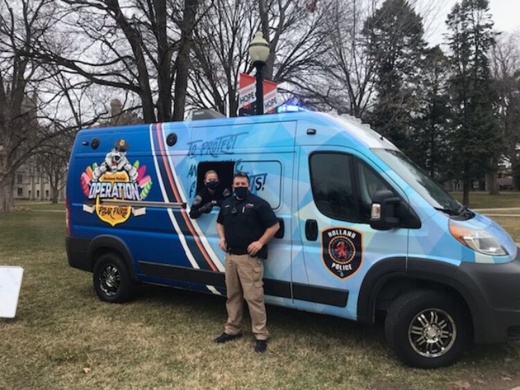 Holland Department of Public Safety Community Policing officers pose with the Polar Patrol vehicle