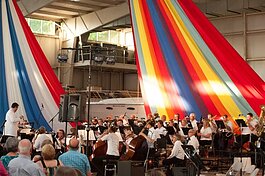 The Holland Symphony Orchestra performs its Pops at the Pier event every year in a celebration of summer fun.