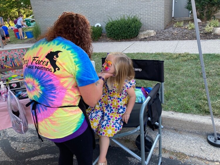 Kids who attended Pumpkinfest enjoyed having their faces painted, climbing on inflatables, riding a barrel train, and playing a variety of fall yard games, including bowling with pumpkins.