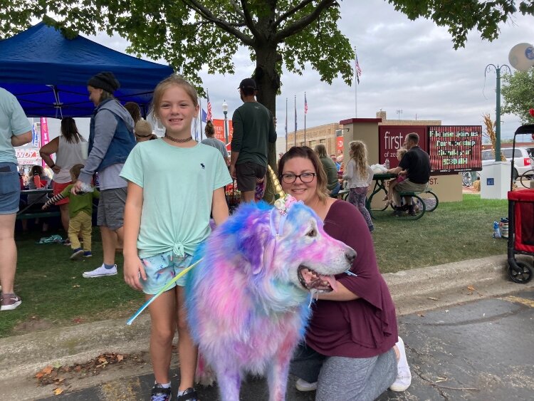 Libby Piotrzkowski, of Holland, participated in the Pumpkinfest pet costume contest for the first time with her dog, Jasper. The Great Pyrenees, a large dog that normally has fluffy white fur, was awash in color, dressed as a unicorn. 