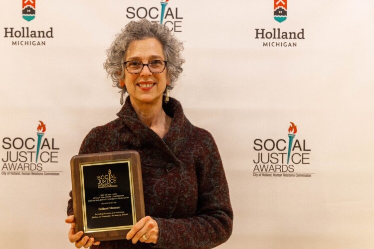 Ricki Levine with the Social Justice Award for Education. 