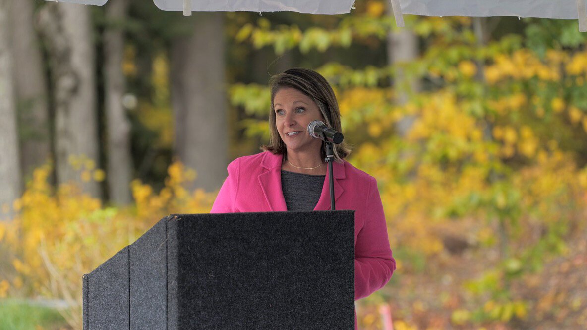 Hadley Streng, CEO of the Grand Haven Area Community Foundation, speaks at the Robinson Landing Block Party. 